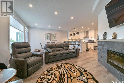 315 3581 Evans Court, Regina, SK - Indoor Photo Showing Living Room With Fireplace