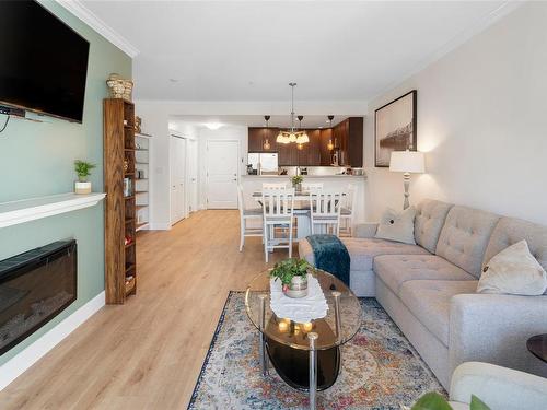 207-2881 Peatt Rd, Langford, BC - Indoor Photo Showing Living Room With Fireplace