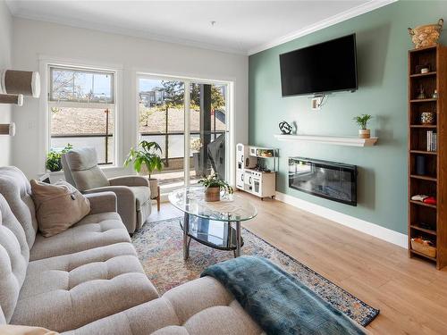 207-2881 Peatt Rd, Langford, BC - Indoor Photo Showing Living Room With Fireplace