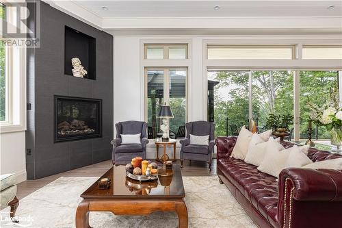 41 Clubhouse Drive, Huntsville, ON - Indoor Photo Showing Living Room With Fireplace