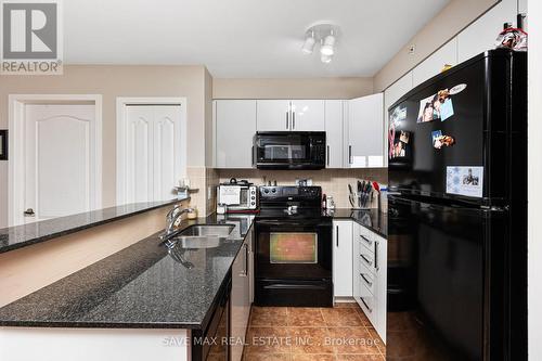 1416 - 8 Dayspring Circle, Brampton, ON - Indoor Photo Showing Kitchen With Double Sink