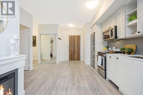 1013 - 251 Manitoba Street, Toronto, ON - Indoor Photo Showing Kitchen With Fireplace