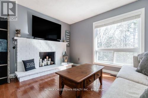 11 Victoria Street E, Innisfil, ON - Indoor Photo Showing Living Room With Fireplace