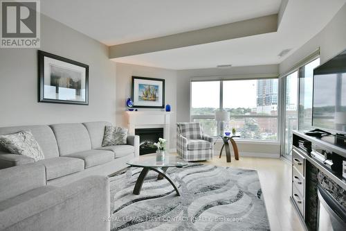 509 - 6 Toronto Street, Barrie, ON - Indoor Photo Showing Living Room With Fireplace