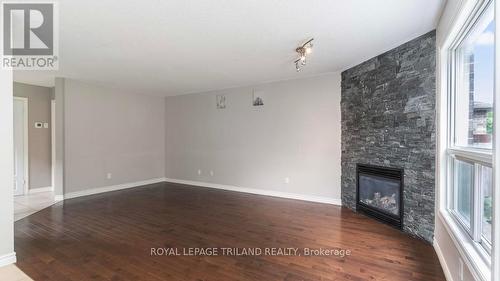 1162 Smither Road, London, ON - Indoor Photo Showing Other Room With Fireplace