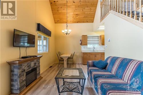 5253 Calabogie Road, Greater Madawaska, ON - Indoor Photo Showing Living Room With Fireplace