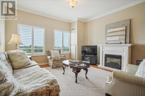 509 - 1499 Nottinghill Gate, Oakville, ON - Indoor Photo Showing Living Room With Fireplace