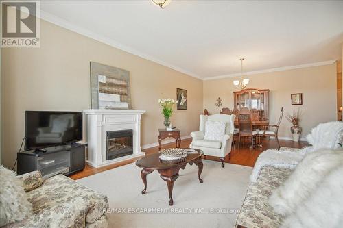 509 - 1499 Nottinghill Gate, Oakville, ON - Indoor Photo Showing Living Room With Fireplace