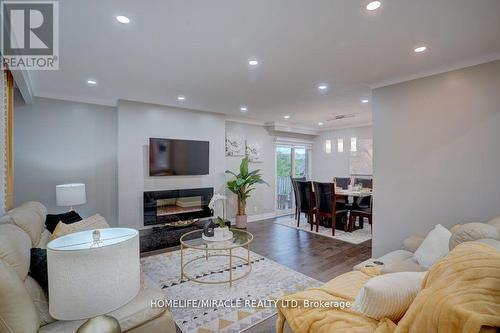 93 Amberjack Boulevard, Toronto, ON - Indoor Photo Showing Living Room With Fireplace