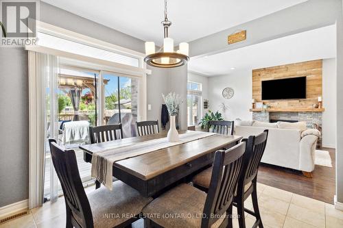 22 Stonefield Gate, Middlesex Centre, ON - Indoor Photo Showing Dining Room With Fireplace