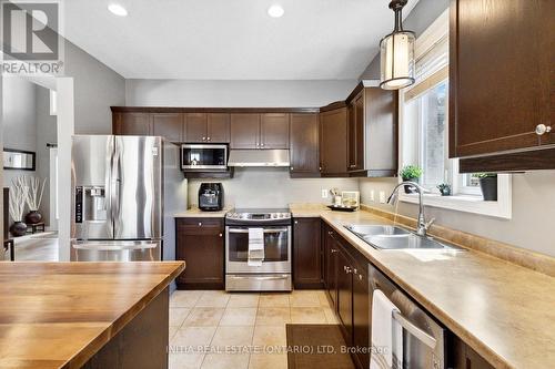 22 Stonefield Gate, Middlesex Centre, ON - Indoor Photo Showing Kitchen With Double Sink