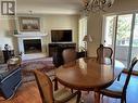 1965 Durnin Road Unit# 217, Kelowna, BC  - Indoor Photo Showing Dining Room With Fireplace 