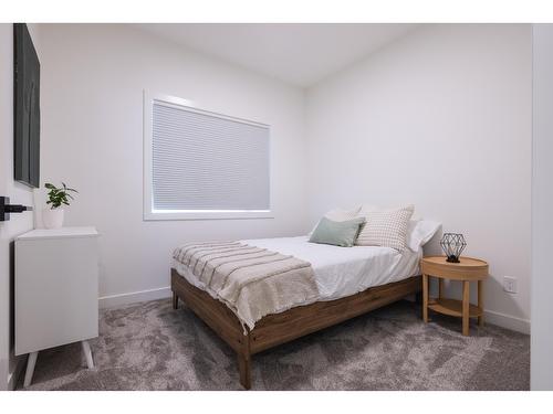 103 - 800 Riverside Way, Fernie, BC - Indoor Photo Showing Bedroom