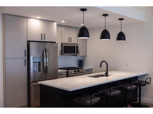 103 - 800 Riverside Way, Fernie, BC - Indoor Photo Showing Kitchen With Double Sink With Upgraded Kitchen