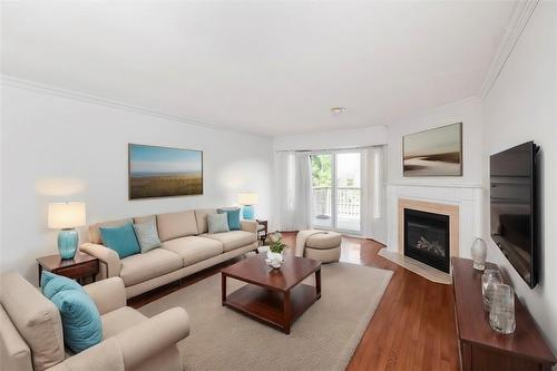 Virtually Staged - 2155 Duncaster Drive|Unit #34, Burlington, ON - Indoor Photo Showing Living Room With Fireplace