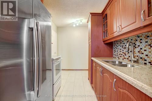 211 - 1250 Bridletowne Circle S, Toronto, ON - Indoor Photo Showing Kitchen With Double Sink