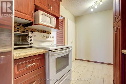 211 - 1250 Bridletowne Circle S, Toronto, ON - Indoor Photo Showing Kitchen