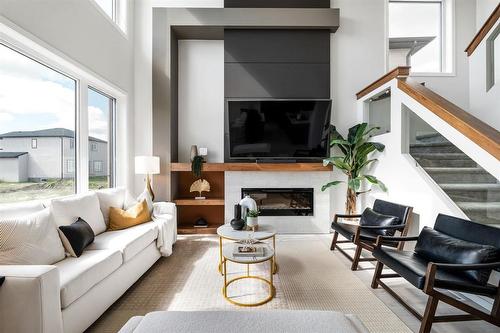 57 Marigold Road, West St Paul, MB - Indoor Photo Showing Living Room With Fireplace