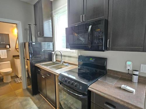 9073 Kealty Road, Kamloops, BC - Indoor Photo Showing Kitchen With Double Sink