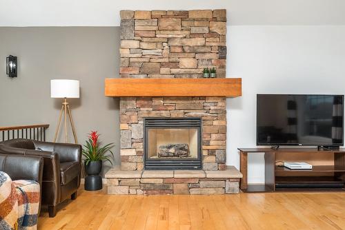 4979 Windsong Crescent, Kelowna, BC - Indoor Photo Showing Living Room With Fireplace