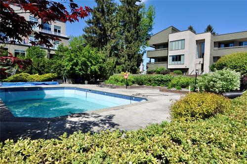 203-1056 Bernard Avenue, Kelowna, BC - Outdoor With In Ground Pool