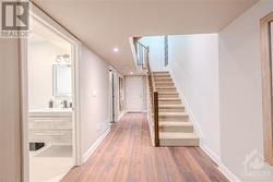 Engineered laminate flooring throughout lower level - 
