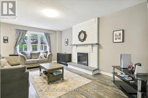 20 Iris Crescent, Brampton, ON - Indoor Photo Showing Living Room With Fireplace