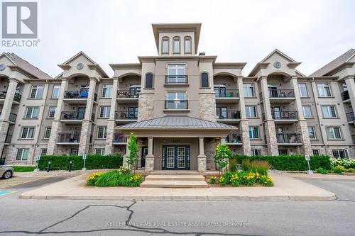 305 - 1470 Main Street E, Milton, ON - Outdoor With Balcony With Facade