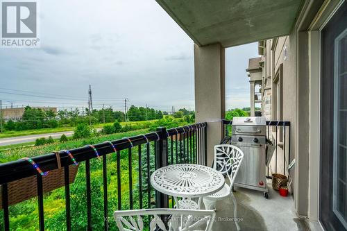 305 - 1470 Main Street E, Milton, ON - Outdoor With Balcony With Exterior