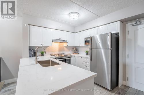 305 - 1470 Main Street E, Milton, ON - Indoor Photo Showing Kitchen With Stainless Steel Kitchen With Upgraded Kitchen