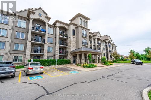 305 - 1470 Main Street E, Milton, ON - Outdoor With Balcony With Facade