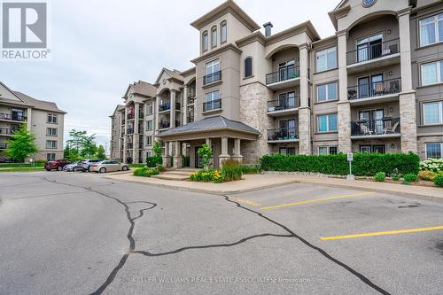 305 - 1470 Main Street E, Milton, ON - Outdoor With Balcony With Facade