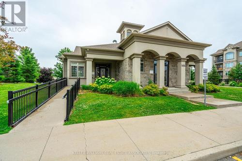 305 - 1470 Main Street E, Milton, ON - Outdoor With Facade