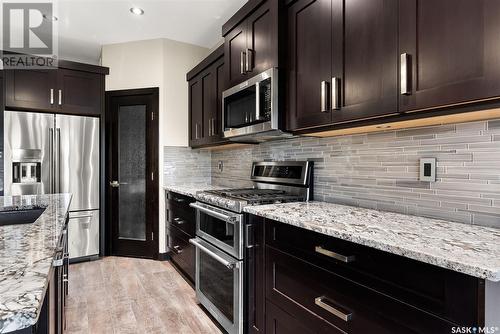 27 College Crescent, White City, SK - Indoor Photo Showing Kitchen With Upgraded Kitchen