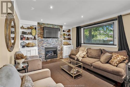 5765 Cabot, Lasalle, ON - Indoor Photo Showing Living Room With Fireplace