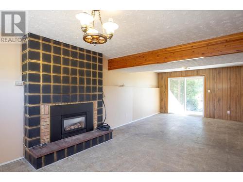 945 Rumney Road, West Kelowna, BC - Indoor Photo Showing Other Room With Fireplace