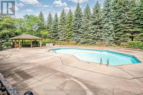 603 - 10 Laurelcrest Street, Brampton, ON - Outdoor With In Ground Pool With Backyard