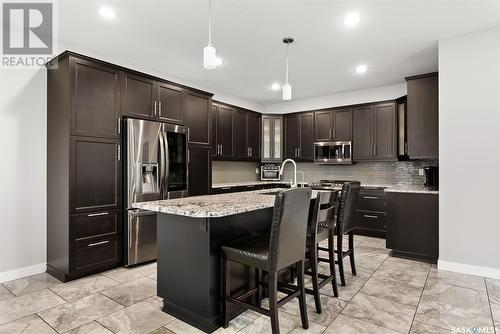 22 Aspen Village Drive, Emerald Park, SK - Indoor Photo Showing Kitchen With Stainless Steel Kitchen With Upgraded Kitchen