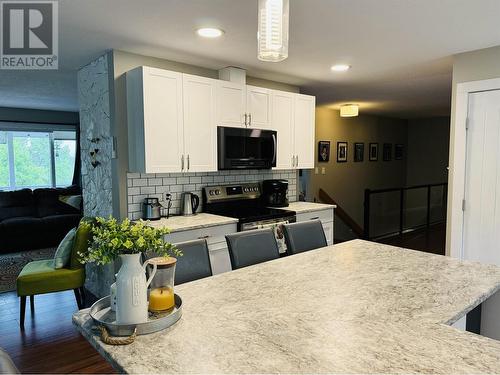 3171 Huston Road, 150 Mile House, BC - Indoor Photo Showing Kitchen With Double Sink