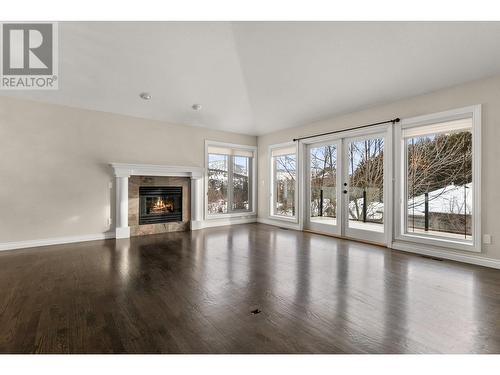3937 Gallaghers Circle, Kelowna, BC - Indoor Photo Showing Living Room With Fireplace