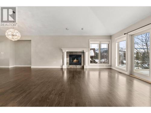 3937 Gallaghers Circle, Kelowna, BC - Indoor Photo Showing Living Room With Fireplace