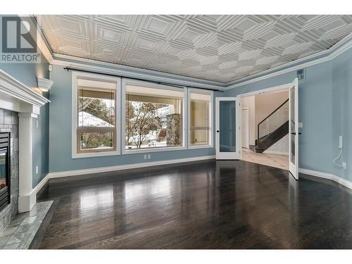 3937 Gallaghers Circle, Kelowna, BC - Indoor Photo Showing Other Room With Fireplace