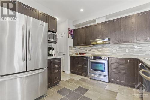 White Pantry cupboad - 273 Enclave Walk, Ottawa, ON - Indoor Photo Showing Kitchen With Stainless Steel Kitchen With Upgraded Kitchen