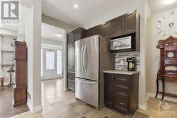 Basement stairs behind kitchen - 