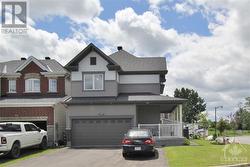 This home features a 2-car garage with inside entry and an extra-wide driveway, offering convenience and accommodating multiple vehicles. - 