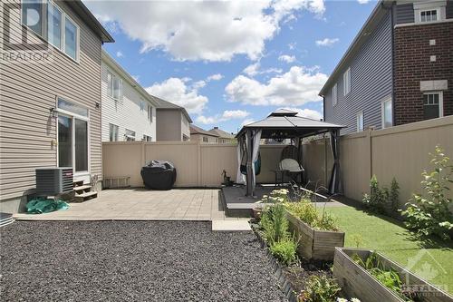 Stunning, maintenance-free yard, perfect for outdoor gatherings - 273 Enclave Walk, Ottawa, ON - Outdoor With Exterior