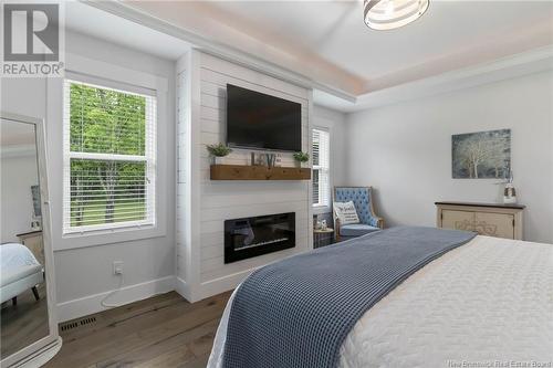 70 Route 933, Grand-Barachois, NB - Indoor Photo Showing Bedroom With Fireplace