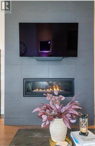 100 - 1705 Fiddlehead Place, London, ON - Indoor Photo Showing Living Room With Fireplace