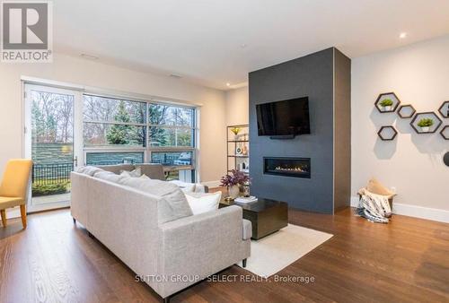 100 - 1705 Fiddlehead Place, London, ON - Indoor Photo Showing Living Room With Fireplace