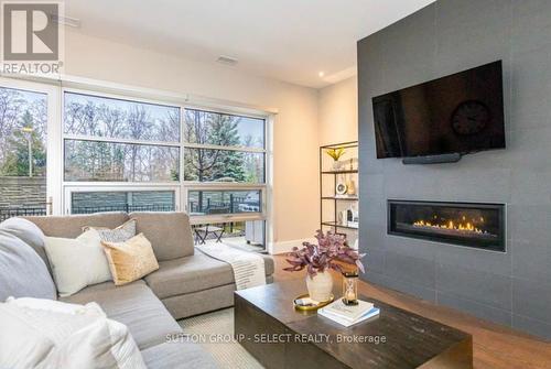 100 - 1705 Fiddlehead Place, London, ON - Indoor Photo Showing Living Room With Fireplace